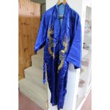 A blue silk kimono with gold thread dragon decoration