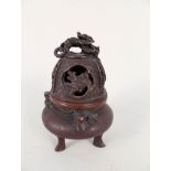 A Chinese bronze Koro with dragon decoration and finial,