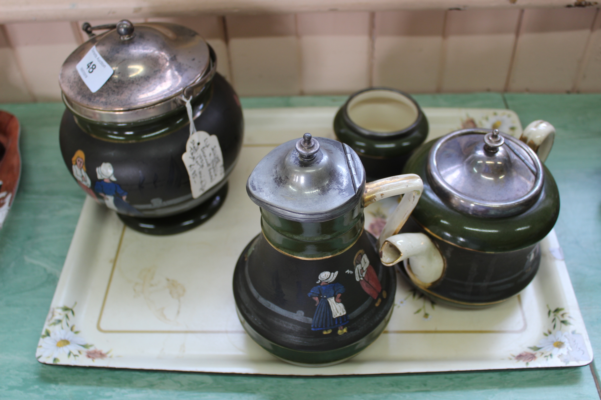 A Victorian Taylor & Tunnicliffe pottery biscuit barrel with silver mounts plus three pieces of tea