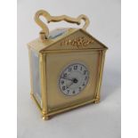 A French brass carriage clock of architectural form