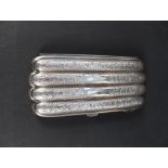 A silver four section cigar case with engraved foliate decoration, initials engraved to front,