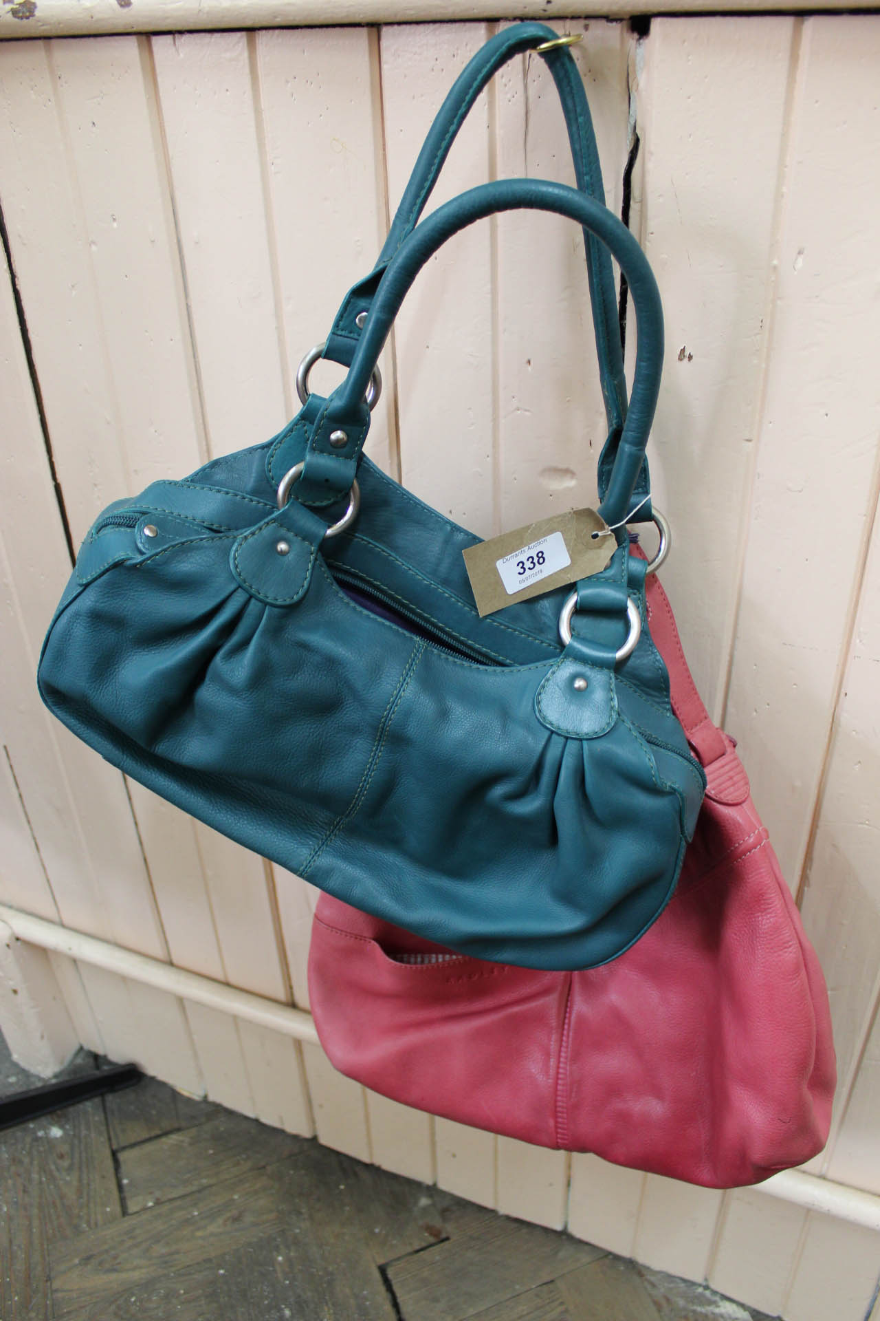 A Radley pink leather handbag plus a Laura Ashley bag in green leather