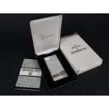 A silver plated Givenchy lighter in box