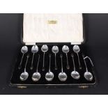 A boxed set of twelve silver coffee bean spoons