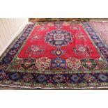 A Persian carpet with multiple geometric designs,