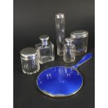 A silver blue enamel dressing table mirror (as found) and a quantity of silver topped glass jars