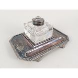 A Walker & Hall cut glass and silver plated inkstand on winged shell feet