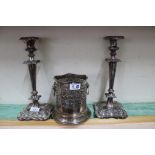 A pair of 19th Century silver plated on copper table candlesticks with wine petal shaped bases and