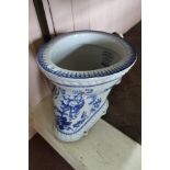 A Pryke & Palmer 'motor' brand blue and white toilet pan with floral decoration