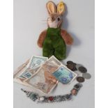 A Steiff rabbit with squeaker plus various coins,