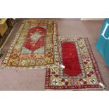 Two Persian geometric rugs