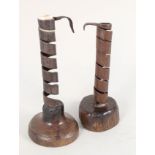 Two 18th Century spiral wood and iron candle holders