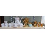 A Susie Cooper Talisman part coffee set plus a Wade gilt decorated part set