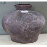 A terracotta bulbous jar with relief carp decoration,