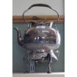 An ornate silver plated spirit kettle and stand with engraved, beaded,