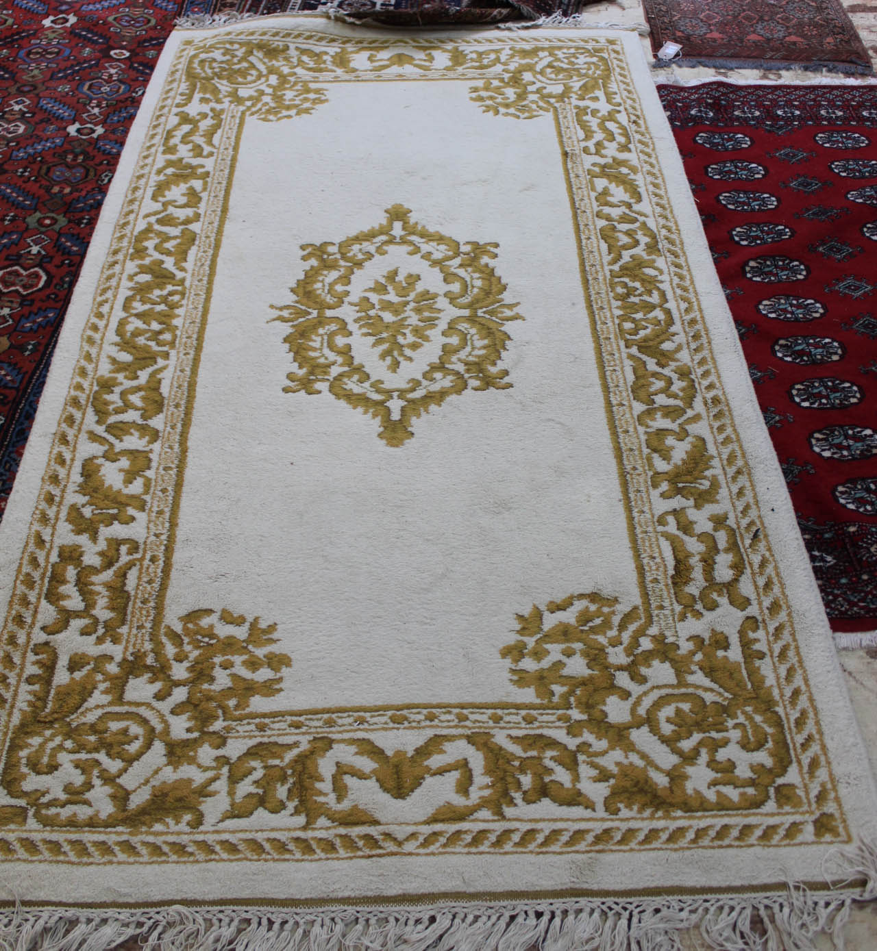 An Indian yellow floral rug,