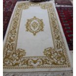 An Indian yellow floral rug,