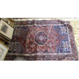 A Persian geometric rug plus one other,