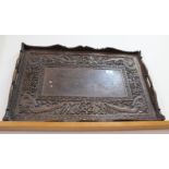 A Chinese carved hardwood dragon decorated tray,