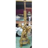 A gilt metal cherub table lamp plus two others