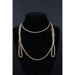 An opera length yellow metal 'rope' necklace,