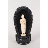 A vintage Chinese ivory figure on later carved wooden stand,