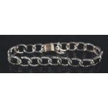 A white metal diamond set bracelet,