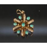 A 9ct gold floral design seed pearl and turquoise set pendant (one pearl missing)
