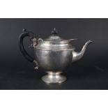 A silver teapot (as found)