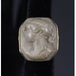 An unusual 9ct gold lava cameo set ring with carved female bust decoration,