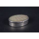 A late 17th Century white metal oval box with carved mother of pearl inset lid
