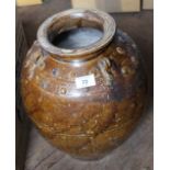 A large Chinese brown ware pot with boss decoration,
