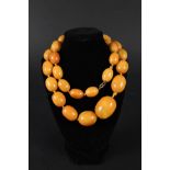 A large amber butterscotch colour graduating bead necklace