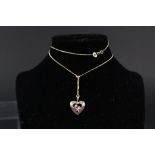 A 14ct gold heart pendant on 14ct gold chain