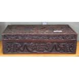 A Chinese carved wooden dragon decorated box