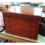 A mahogany four drawer collectors cabinet