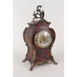 A 19th Century French boulle waisted mantel clock with Rococo gilt metal mounts