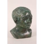 An African green stone bust (signed)