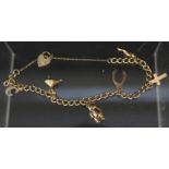 A 9ct gold charm bracelet set with five charms