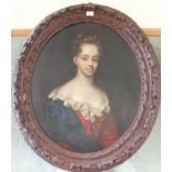 A 19th Century oval oil on canvas of a half length portrait of a lady in foliate carved frame,