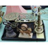 A spelter lion clock, Victorian brass candlesticks,