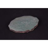 A oval silver and shagreen compact,