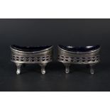 A pair of Georgian silver salts with blue glass liners