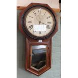 An octagonal mahogany drop dial wall clock