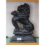 A Victorian cast iron lion doorstop