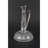 A silver and glass claret jug with etched decoration,
