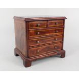 A miniature inlaid walnut Georgian style chest of drawers