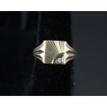 A gents 9ct gold signet ring with engraved decoration set with white stone,