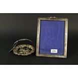 A large silver photograph frame with ribbon detail to top (as found),