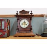 A mahogany striking mantel clock